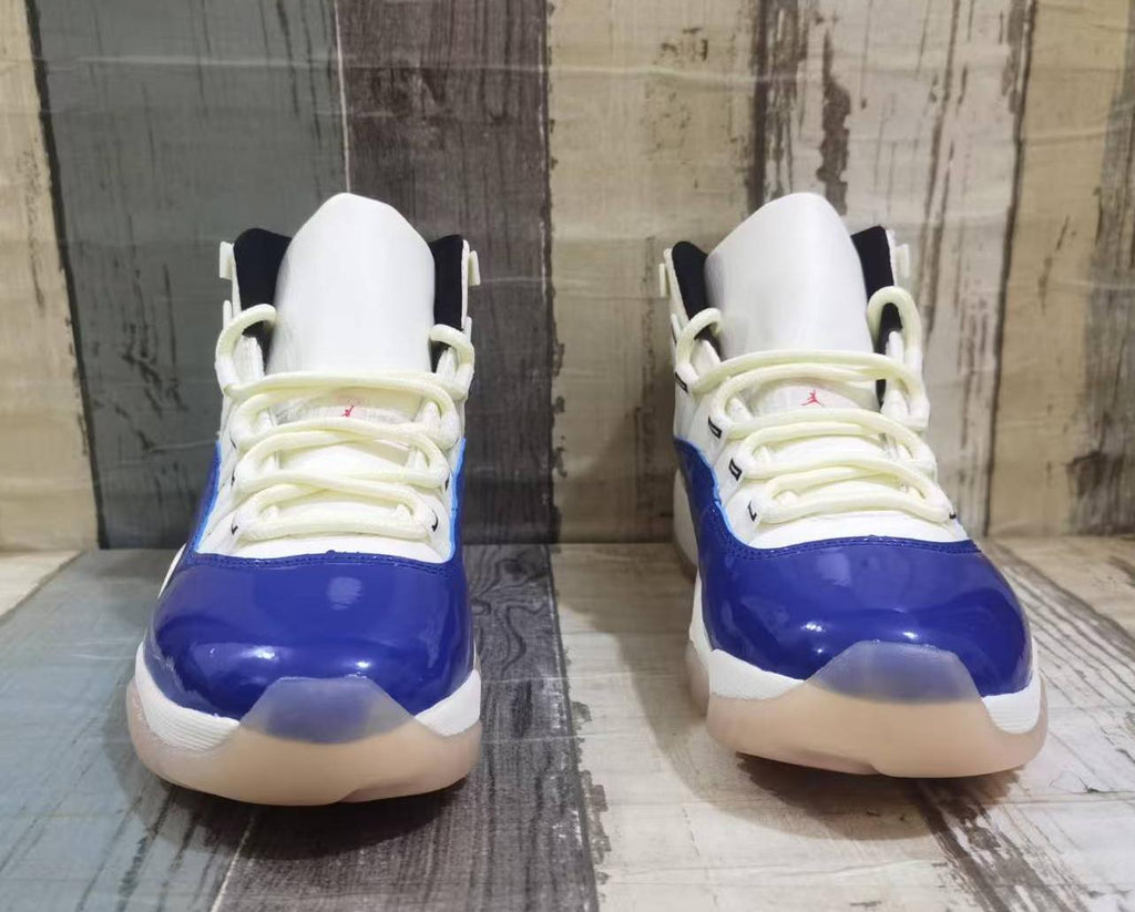 Air Jordan 11 Retro High-Top Sneakers – White, Blue & Red